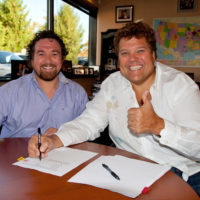 Jimmy John's Founder Jimmy John Liautaud Signing Papers with Jimmy John's CEO James North
